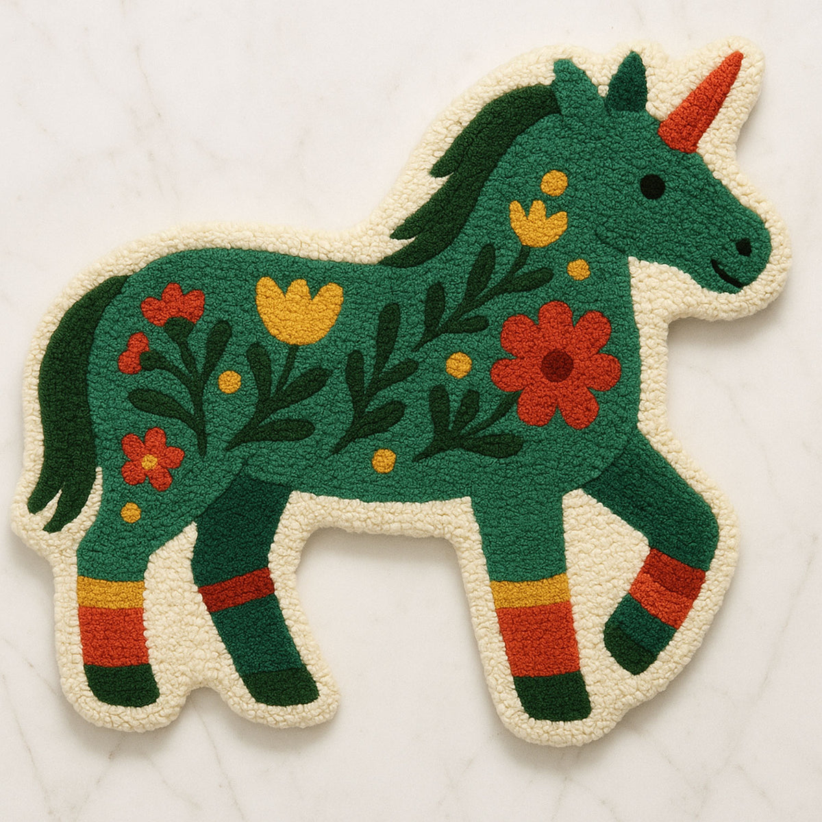 Feblilac Unicorn Pony tufted bath mat in a bright bathroom beside the bathtub