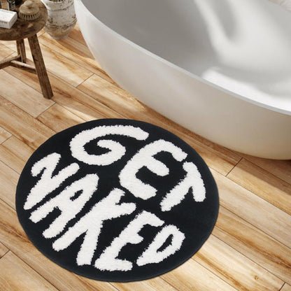 Feblilac Get Naked tufted bath mat in a bright bathroom beside the bathtub