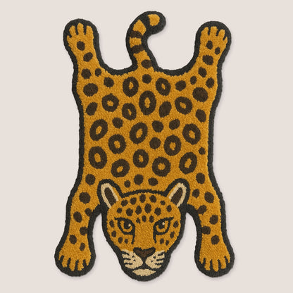 Feblilac Leopard tufted bath mat in a bright bathroom beside the bathtub