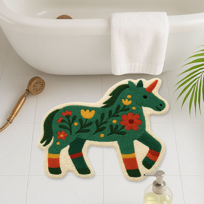 Feblilac Unicorn Pony tufted bath mat in front of a bathroom vanity with fresh towels