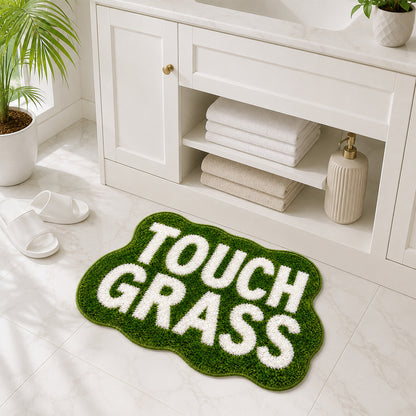 Feblilac TOUCH GRASS tufted bath mat in green beside a bathroom vanity