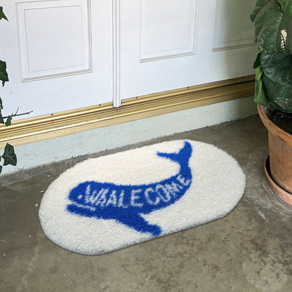 Feblilac Whalecome PVC coil door mat in a bright bathroom beside the bathtub