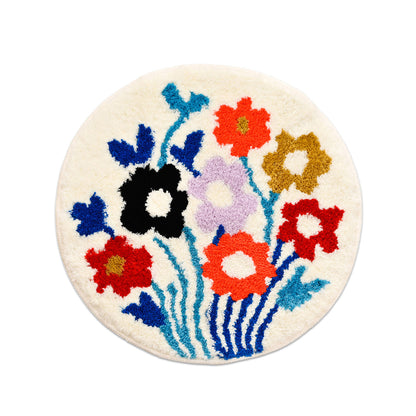 Feblilac Round Flower Garden tufted bath mat in a bright bathroom beside the bathtub