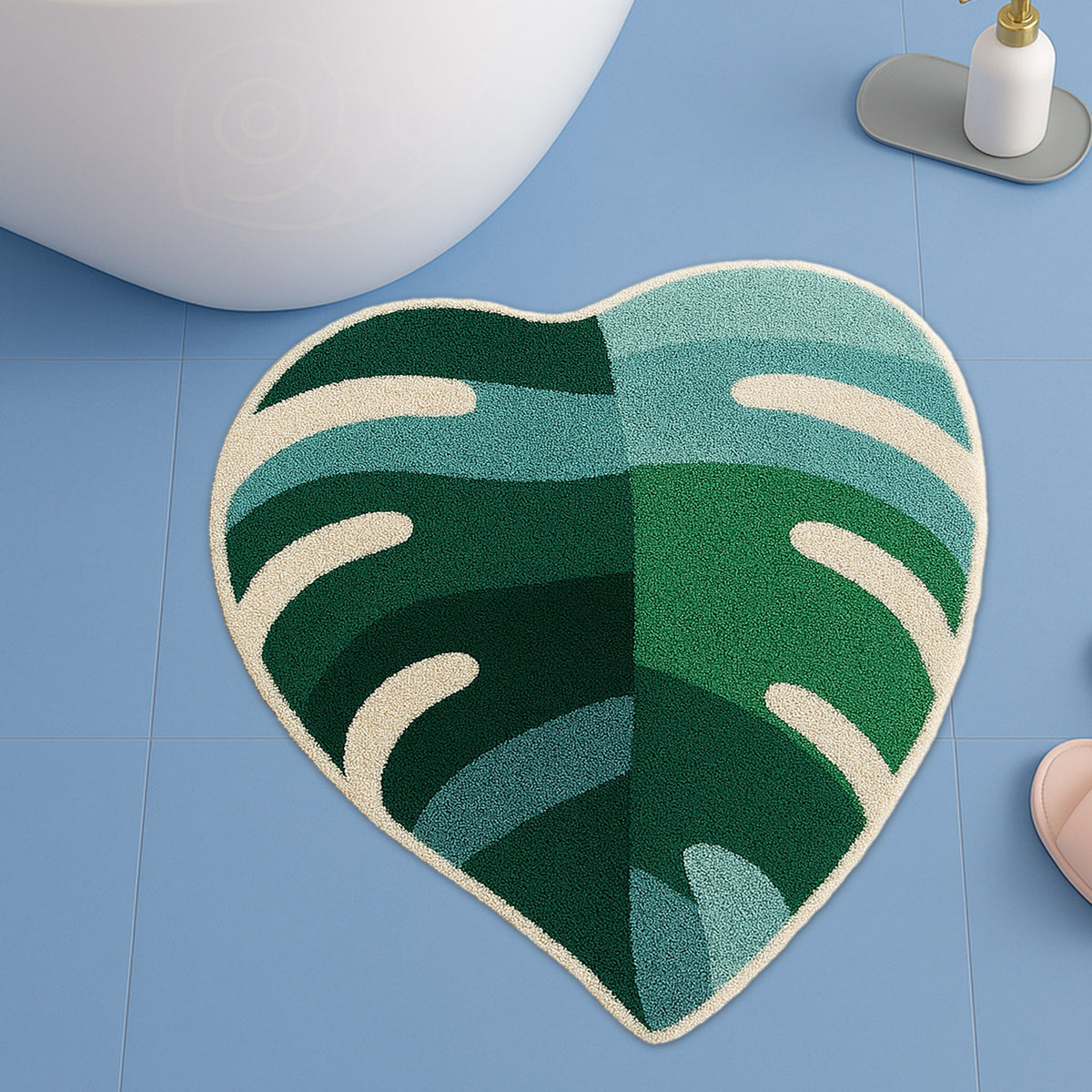 Feblilac Green Leaves with Pink Heart tufted bath mat in a bright bathroom beside the bathtub