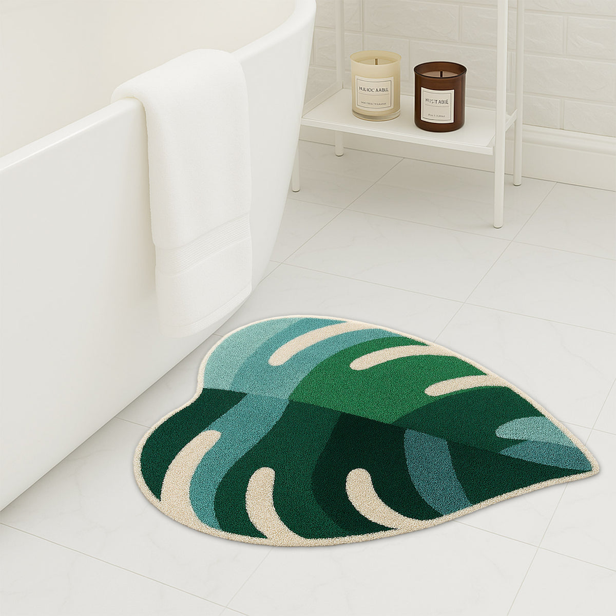 Feblilac Green Leaves with Pink Heart tufted bath mat on a wood floor next to a soaking tub