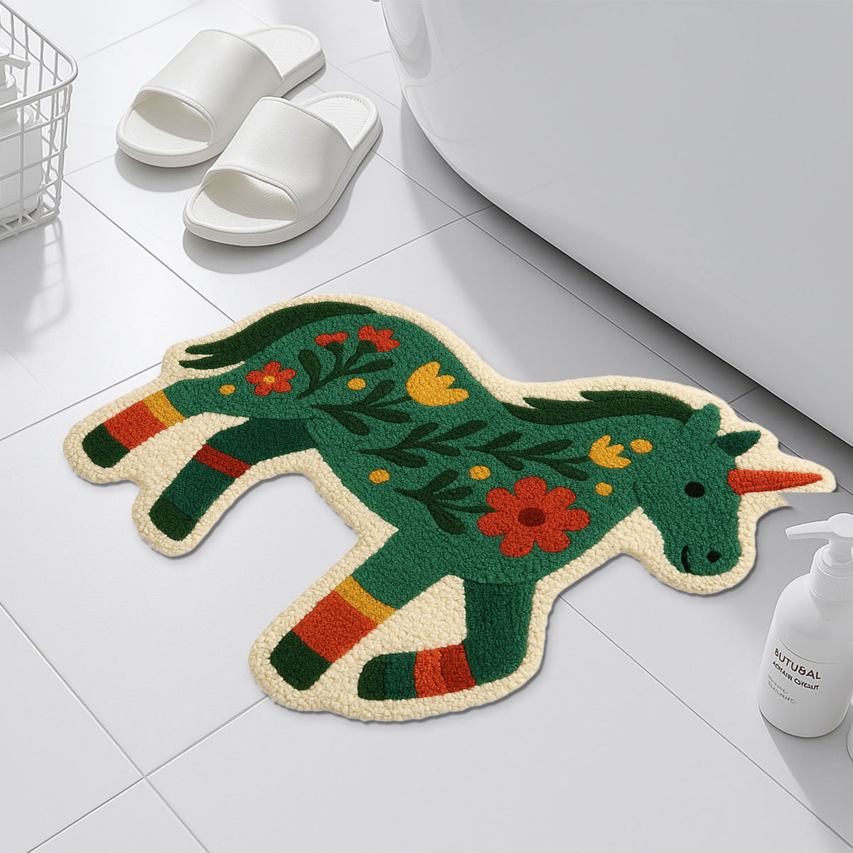Feblilac Unicorn Pony tufted bath mat on a wood floor next to a soaking tub