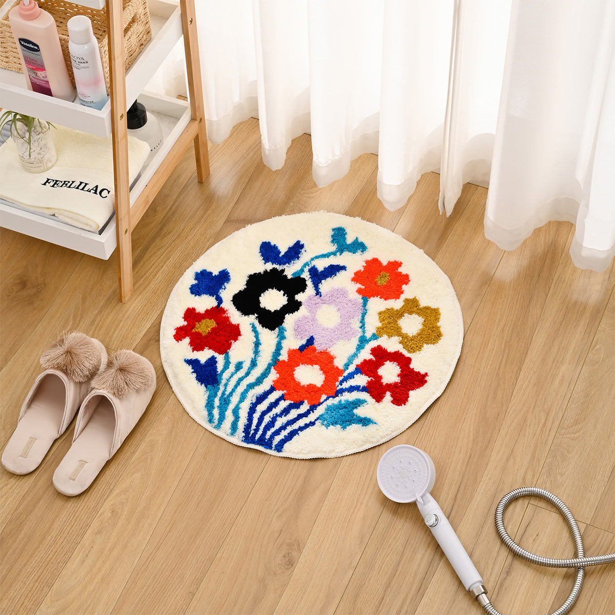 Feblilac Round Flower Garden tufted bath mat in front of a bathroom vanity with fresh towels