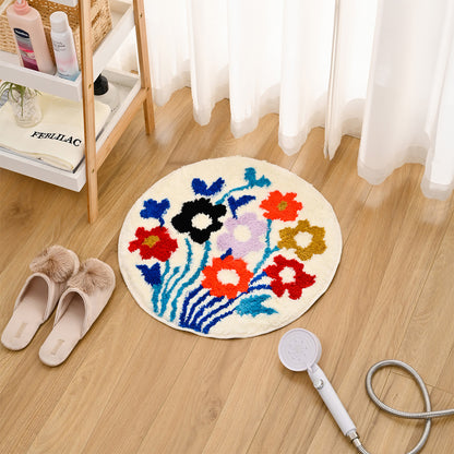Feblilac Round Flower Garden tufted bath mat in front of a bathroom vanity with fresh towels
