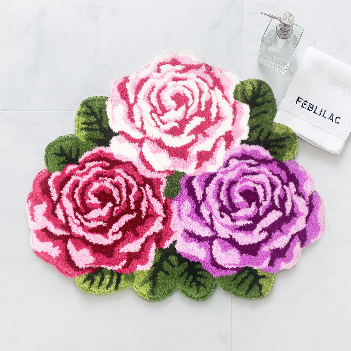 Feblilac Three Flowers tufted bath mat in front of a bathroom vanity with fresh towels