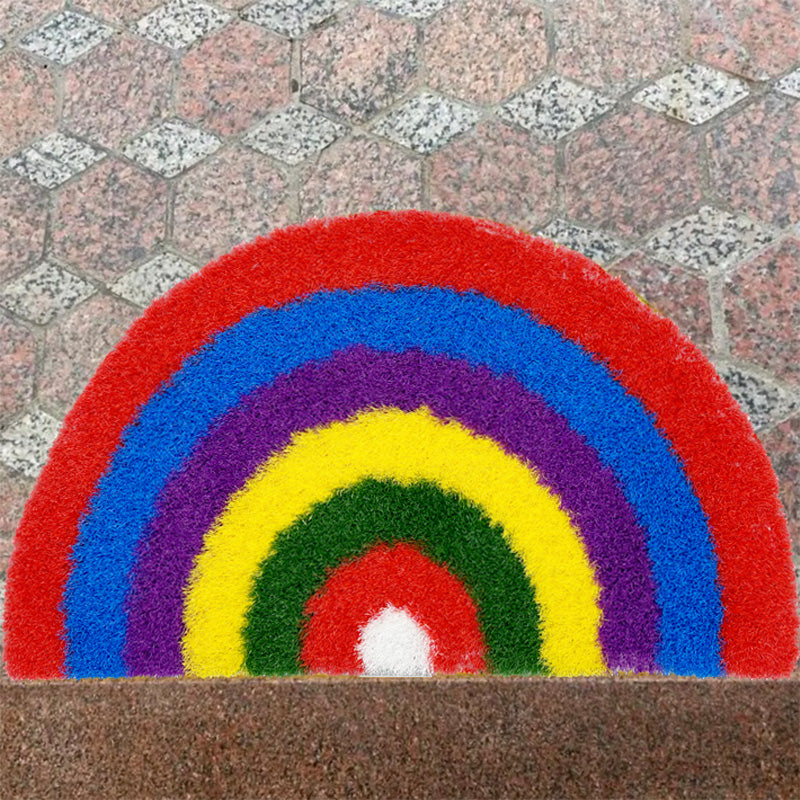 Feblilac Semicircle Rainbow PVC coil door mat in front of a bathroom vanity with fresh towels