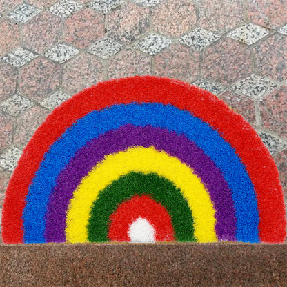 Feblilac Semicircle Rainbow PVC coil door mat in front of a bathroom vanity with fresh towels