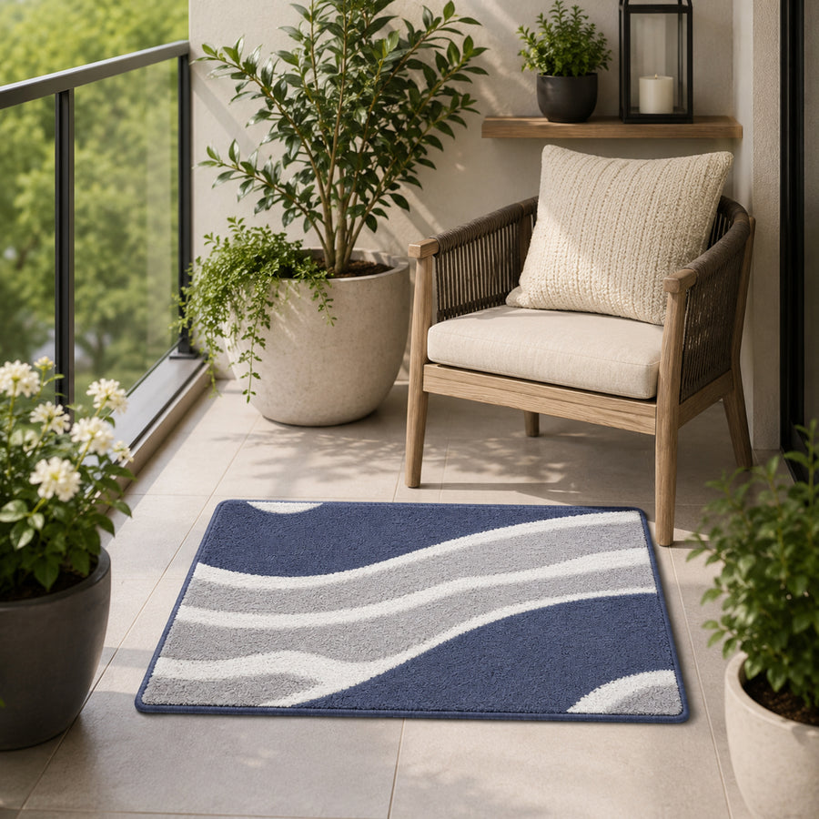 Feblilac White Grey and Blue Minimal Pattern tufted bath mat in front of a bathroom vanity with fresh towels