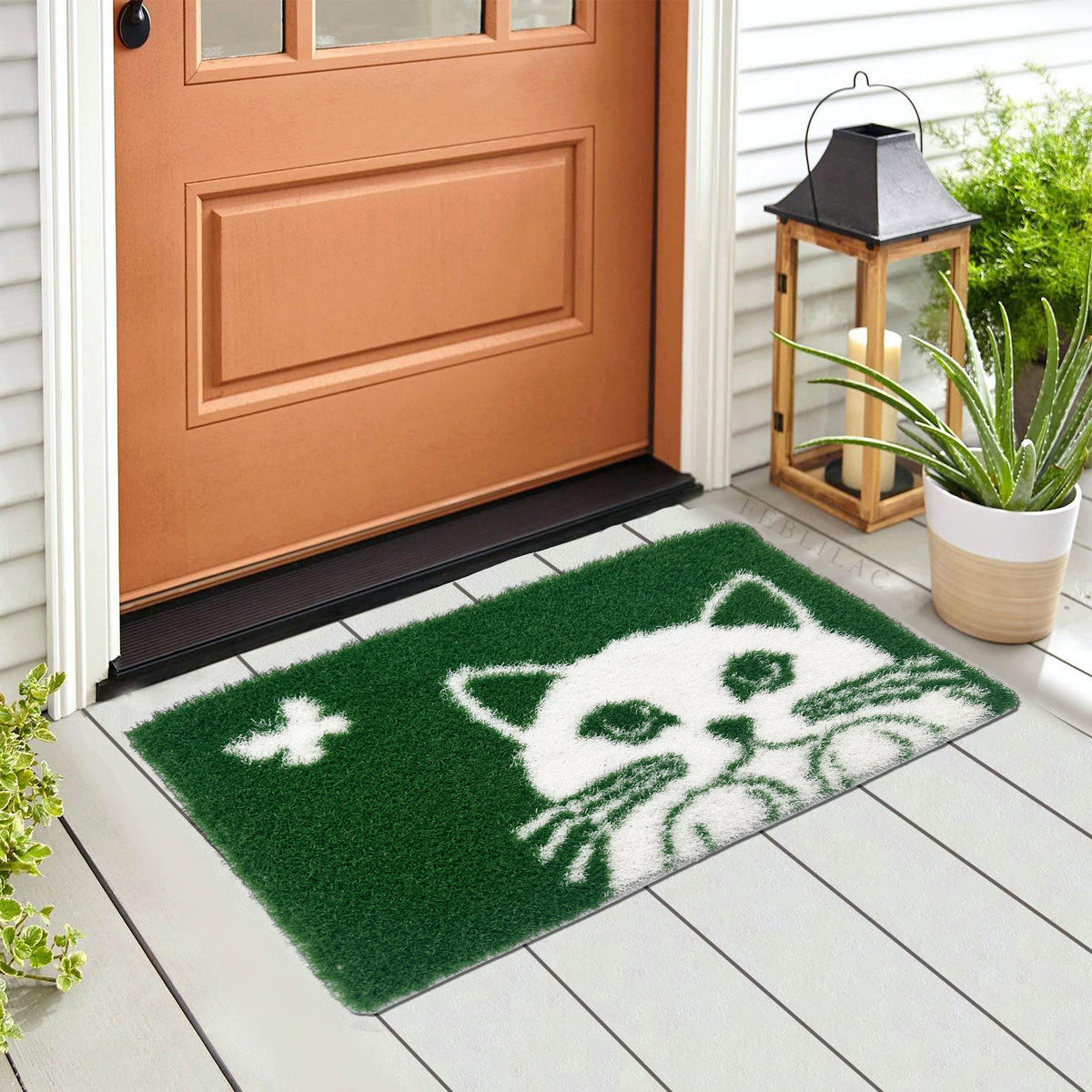 Feblilac Cat and Butterfly PVC coil door mat in front of a bathroom vanity with fresh towels