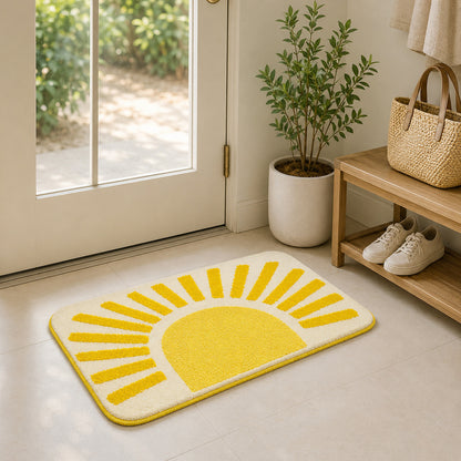 Feblilac Golden Sun tufted bath mat on a wood floor next to a soaking tub