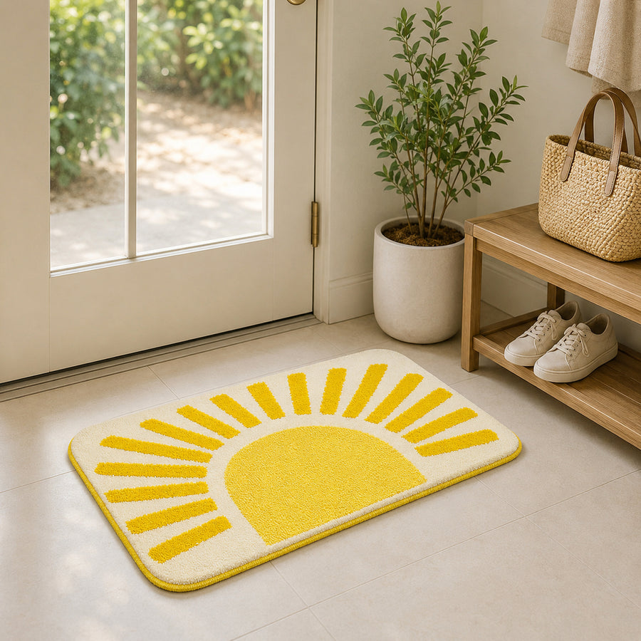Feblilac Golden Sun tufted bath mat on a wood floor next to a soaking tub