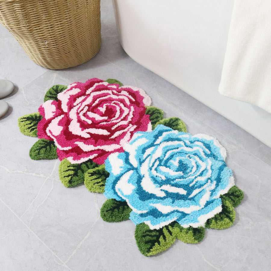 Feblilac Two Flowers tufted bath mat on a wood floor next to a soaking tub