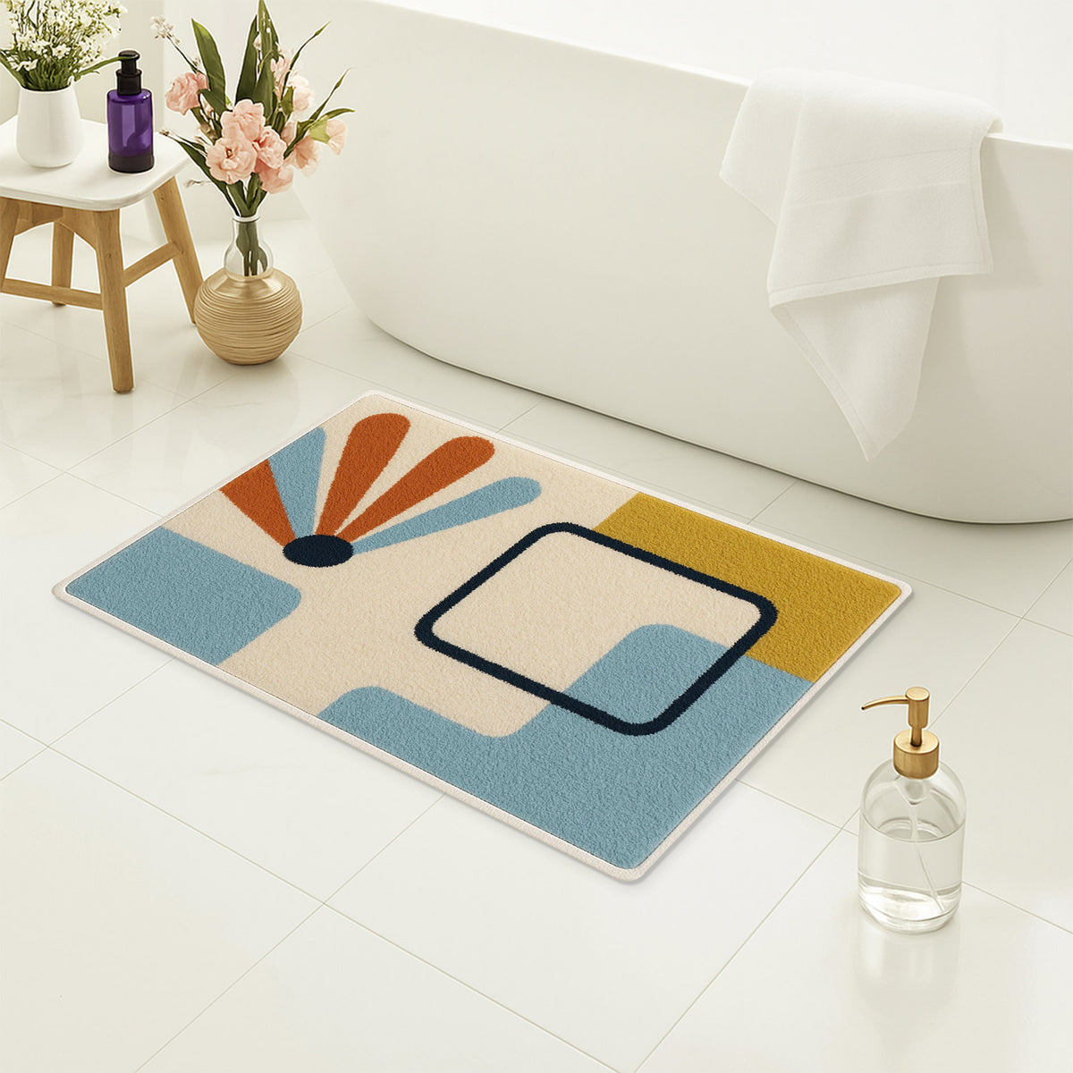 Feblilac Minimal Blue Yellow Black Geometric tufted bath mat on a wood floor next to a soaking tub