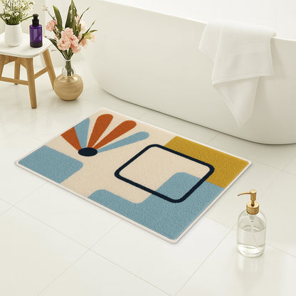 Feblilac Minimal Blue Yellow Black Geometric tufted bath mat on a wood floor next to a soaking tub