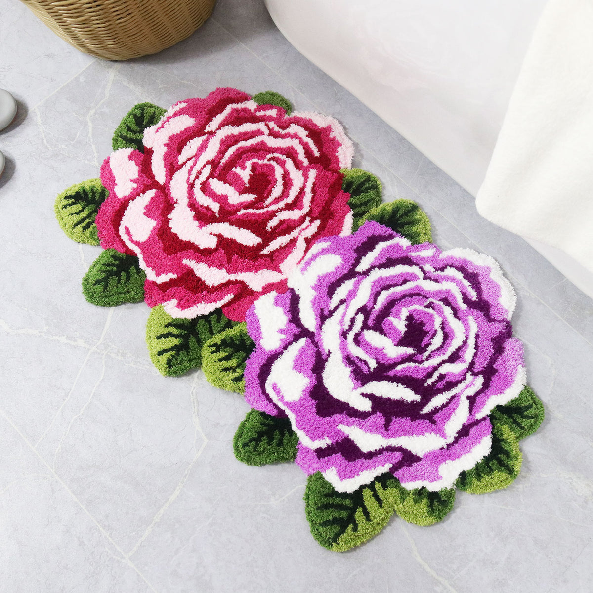 Feblilac Two Flowers tufted bath mat on a wood floor next to a soaking tub