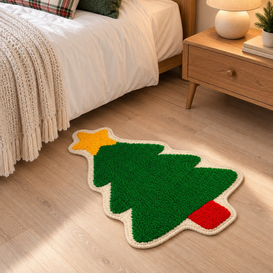 Feblilac Christmas Tree tufted bath mat on a wood floor next to a soaking tub