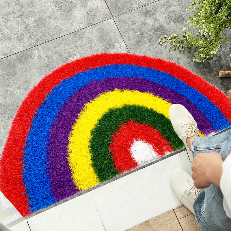 Feblilac Semicircle Rainbow PVC coil door mat on a wood floor next to a soaking tub