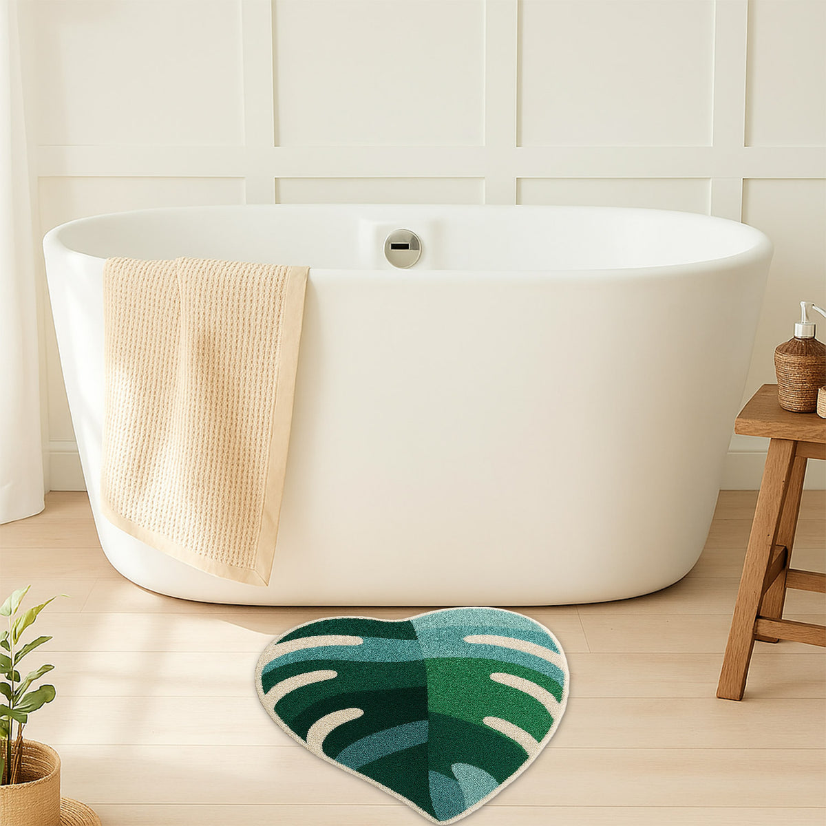 Feblilac Green Leaves with Pink Heart tufted bath mat by the sink with slippers and a towel basket