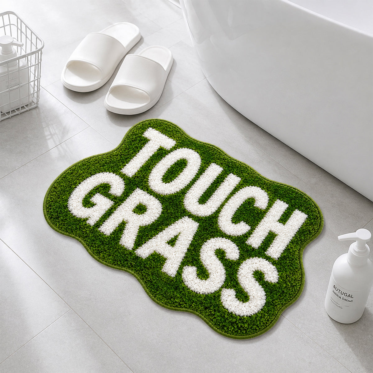 TOUCH GRASS green tufted rug by a bathtub with white slippers and towel basket