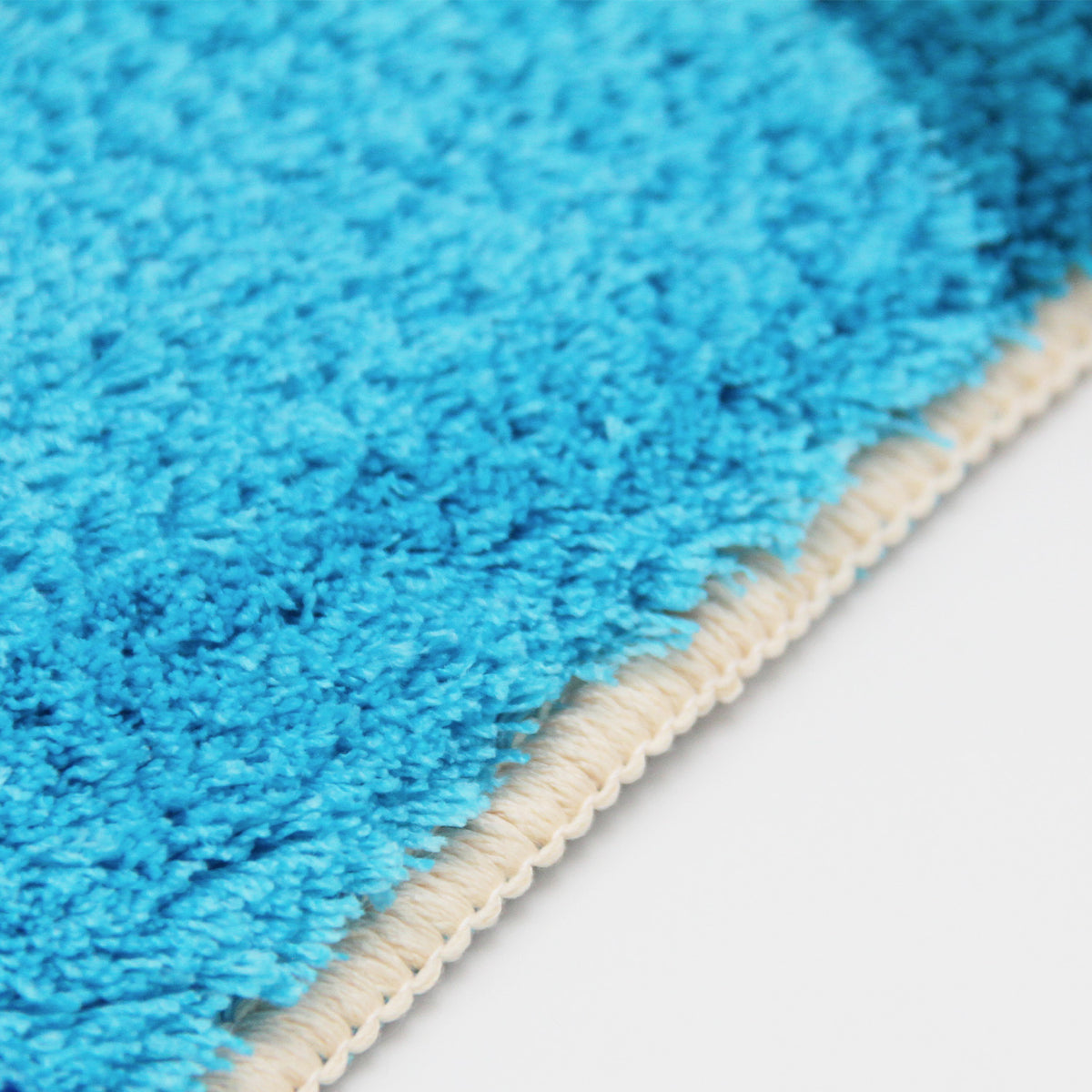 Feblilac Abstract Flower Pots tufted bath mat in a sunny bathroom with a potted plant