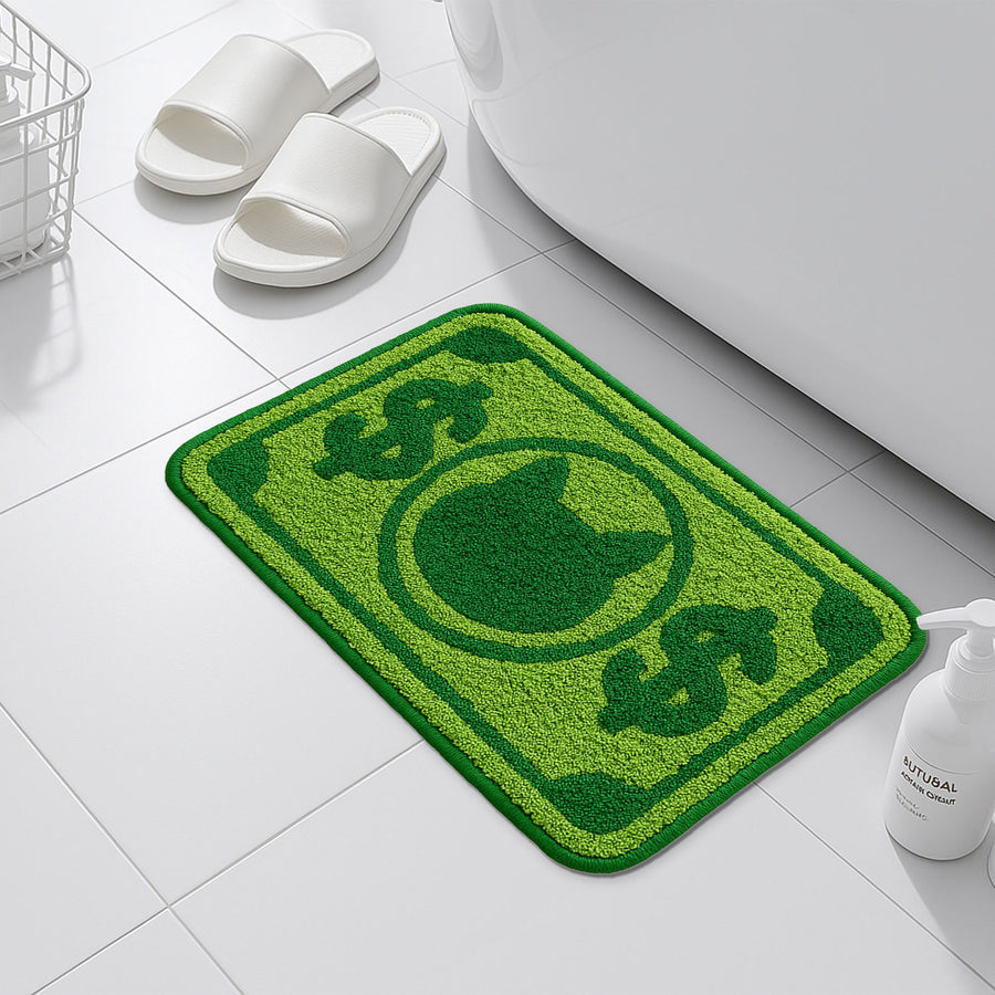 Feblilac Green Cat and Dollar tufted bath mat in a sunny bathroom with a potted plant