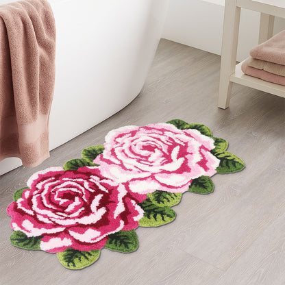 Feblilac Two Flowers tufted bath mat by the sink with slippers and a towel basket