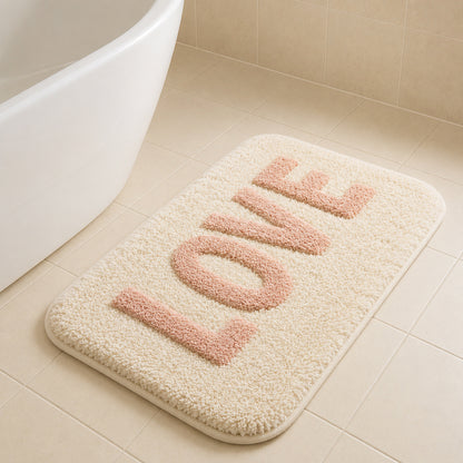 Feblilac LOVE tufted bath mat on cream tiles with freestanding tub
