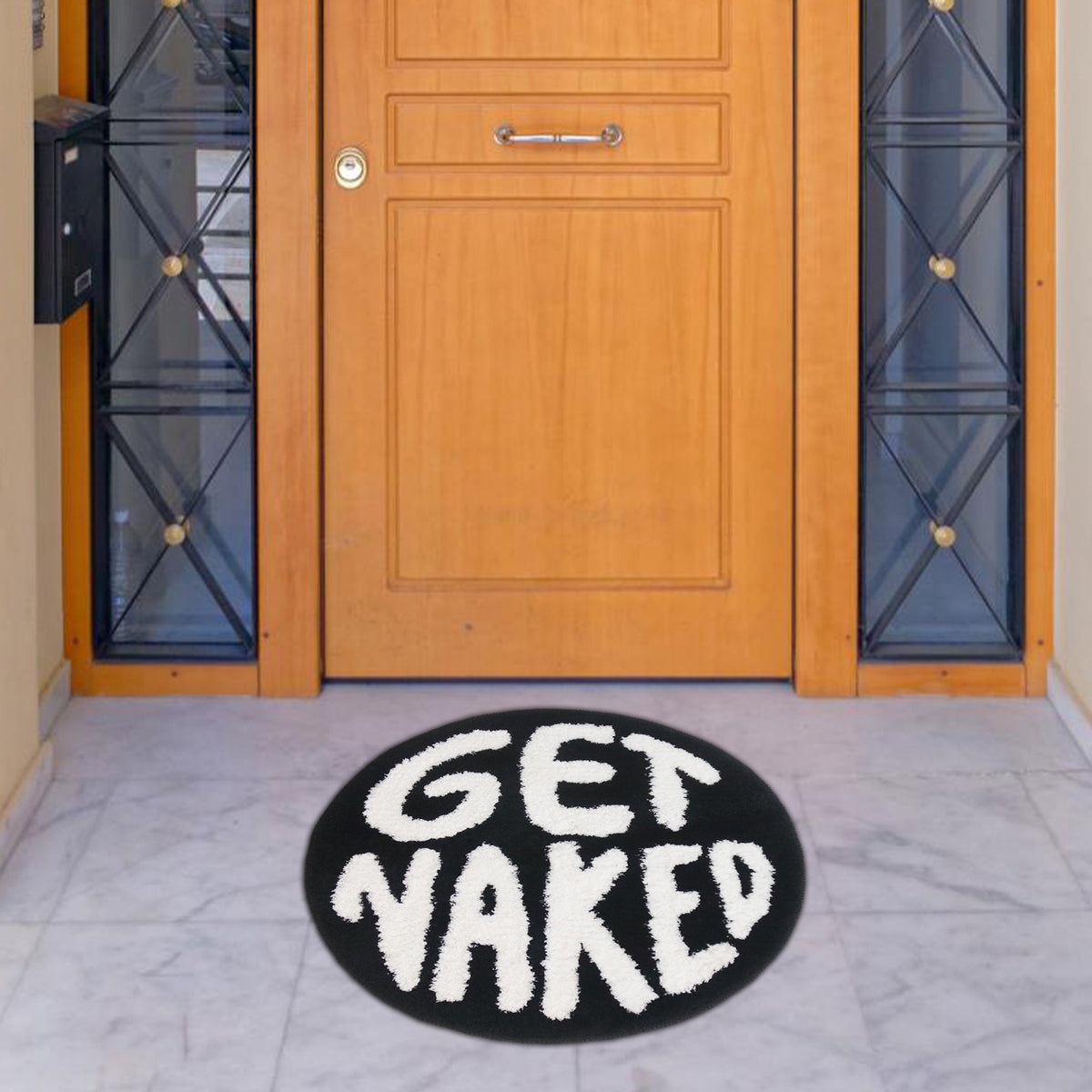 Feblilac Get Naked tufted bath mat styled in a cosy bathroom corner