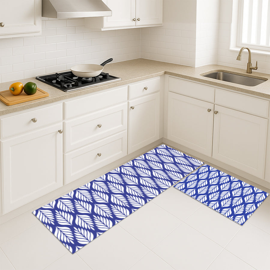 Feblilac White Leaves on Blue kitchen mat on a wood floor beside the sink