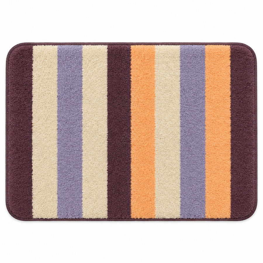 Feblilac Orange and Purple Stripes tufted bath mat in a bright bathroom beside the bathtub