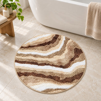 Feblilac Jupiter Marble Round tufted bath mat in front of the bathtub in natural light