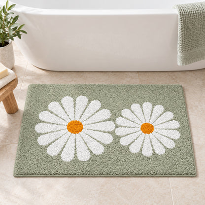Feblilac Green Daisy Duo tufted bath mat in front of the bathtub in natural light