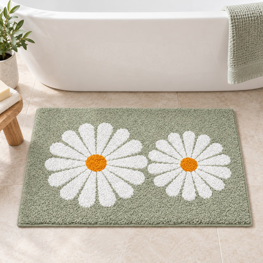Feblilac Green Daisy Duo tufted bath mat in front of the bathtub in natural light