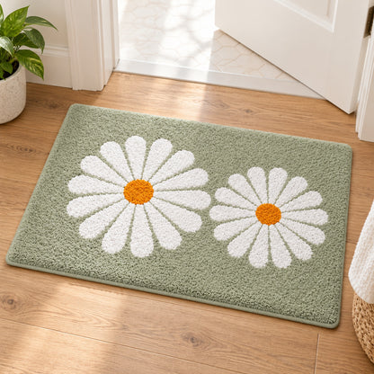 Feblilac Green Daisy Duo tufted bath mat on a light wood floor at the doorway