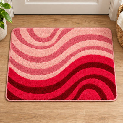 Feblilac Minimal Abstract Curves tufted bath mat on a wood floor next to a soaking tub