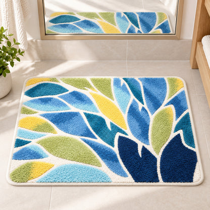 Feblilac Blue and Green Leaves Tufted Bath Mat – Botanical Bathroom Rug in front of a bathroom mirror and sink