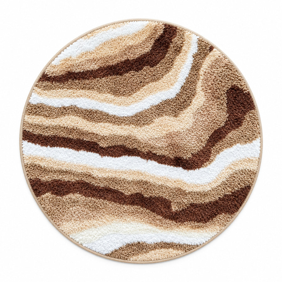Feblilac Jupiter Marble Round tufted bath mat on a light wood floor at the doorway