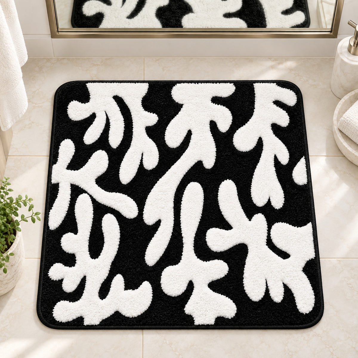 Feblilac Coral tufted bath mat in a sunny bathroom with a potted plant