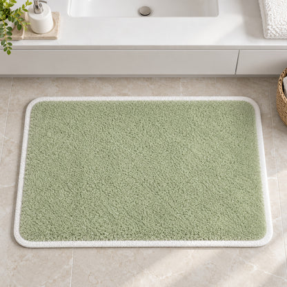 Feblilac Green with White Border tufted bath mat styled in a cosy bathroom corner
