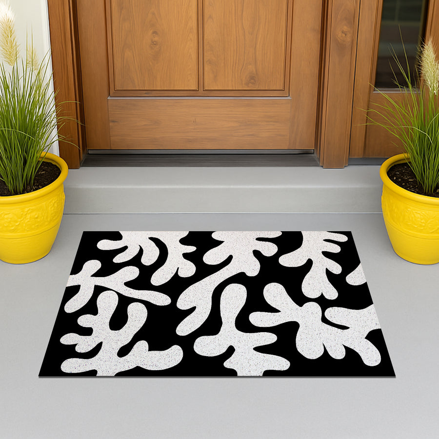 Feblilac Coral PVC coil door mat at the front door on a tiled porch