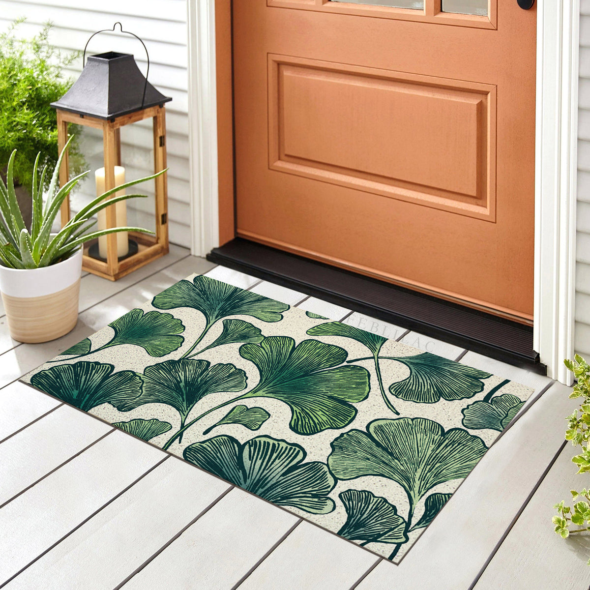 Feblilac Ginkgo Leaf Pattern PVC coil door mat at the front door on a tiled porch