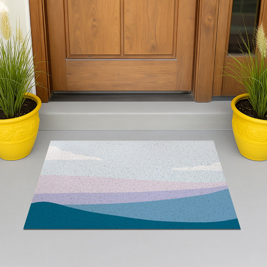 Feblilac Blue and Purple Mountain Mist PVC Coil Door Mat – Abstract Landscape Entrance Mat at a wooden front door with potted plants