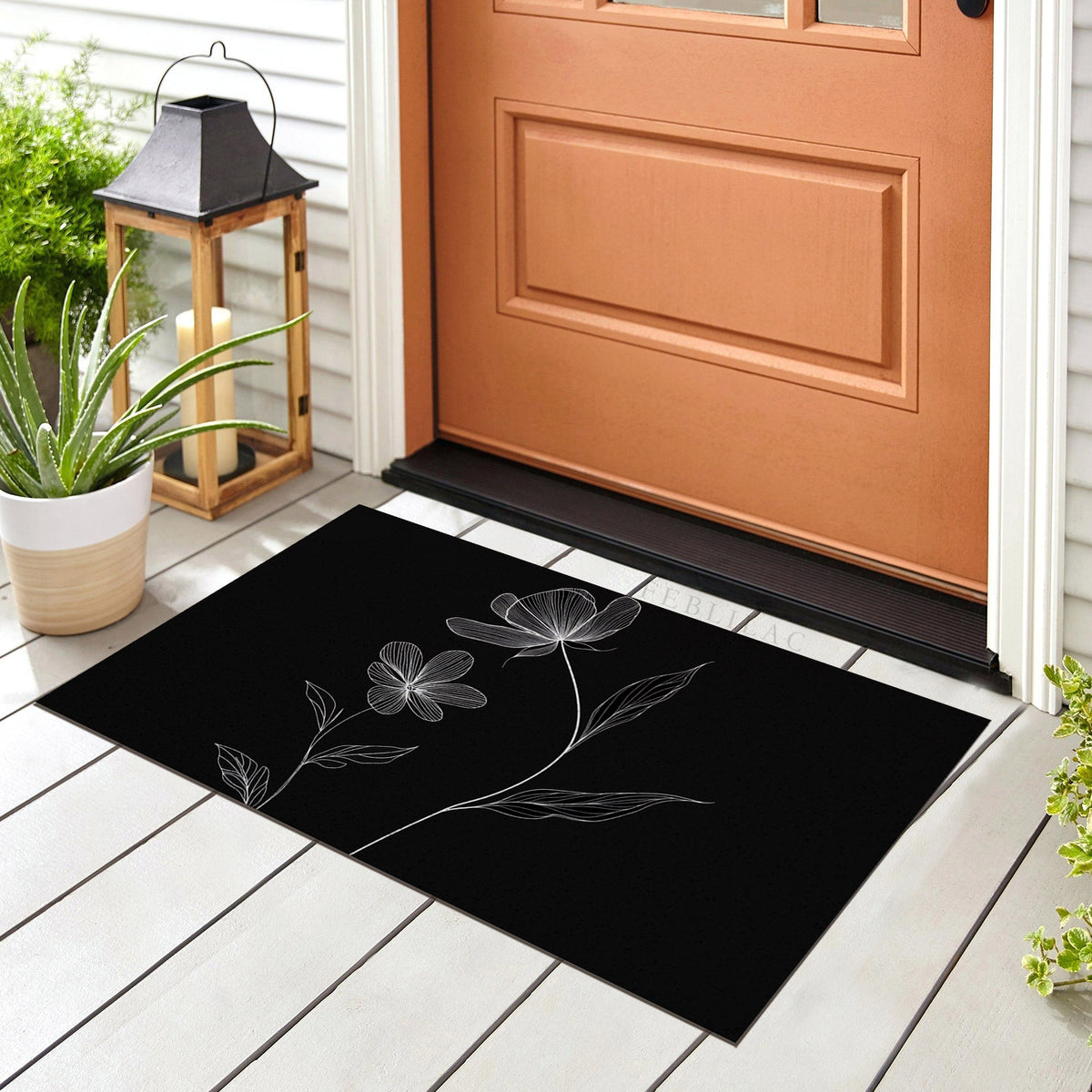 Feblilac Minimal Black and White Flowers PVC coil door mat at the front door on a tiled porch