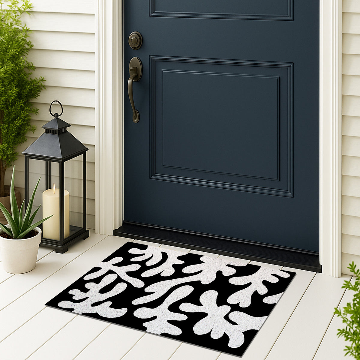 Feblilac Coral PVC coil door mat on a doorstep with potted plants