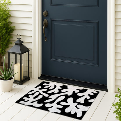 Feblilac Coral PVC coil door mat on a doorstep with potted plants