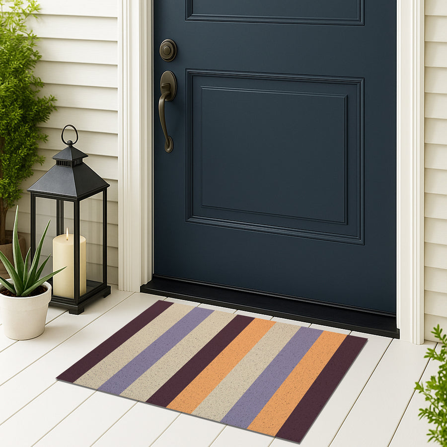 Feblilac Orange and Purple Stripes PVC coil door mat on a doorstep with potted plants